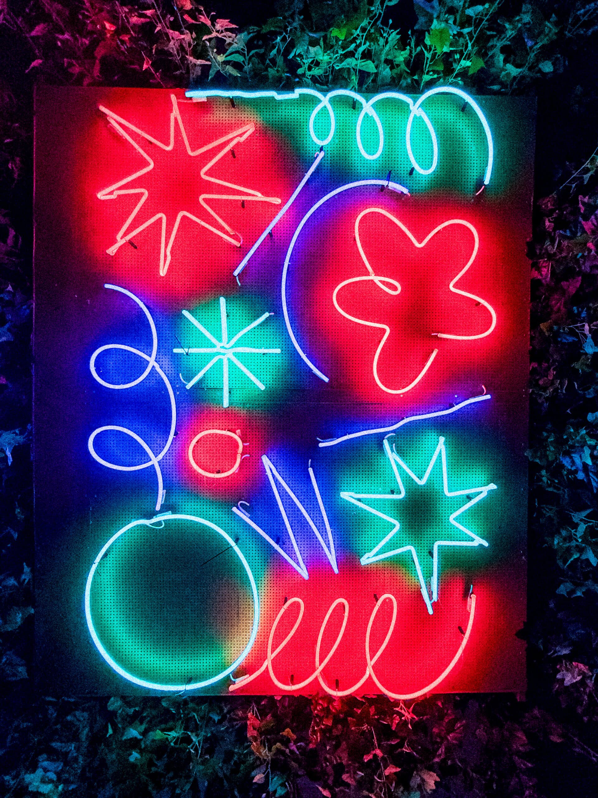 Colorful neon light art installation with abstract shapes
