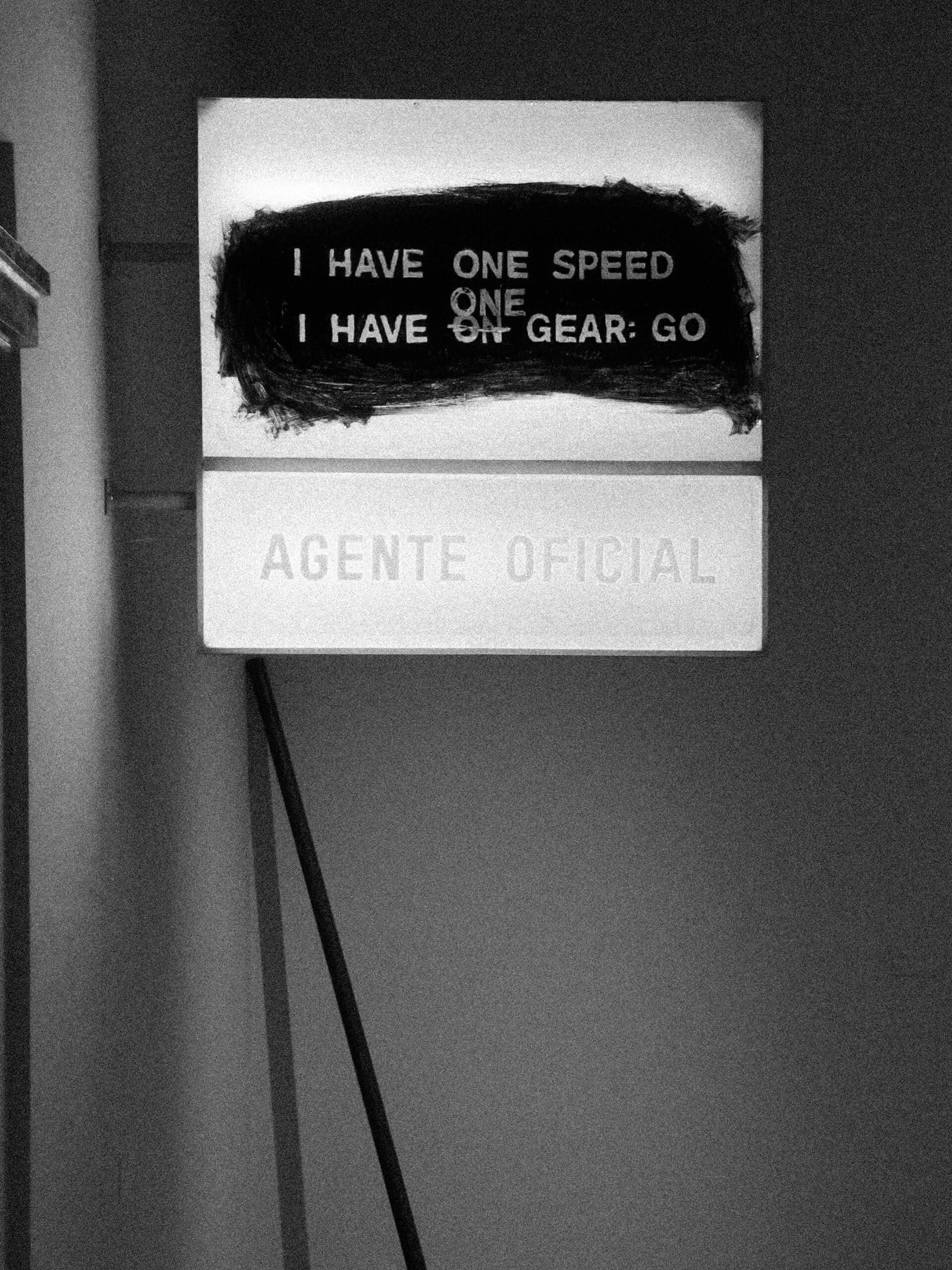 Wall sign reading I have one speed one gear go in black and white