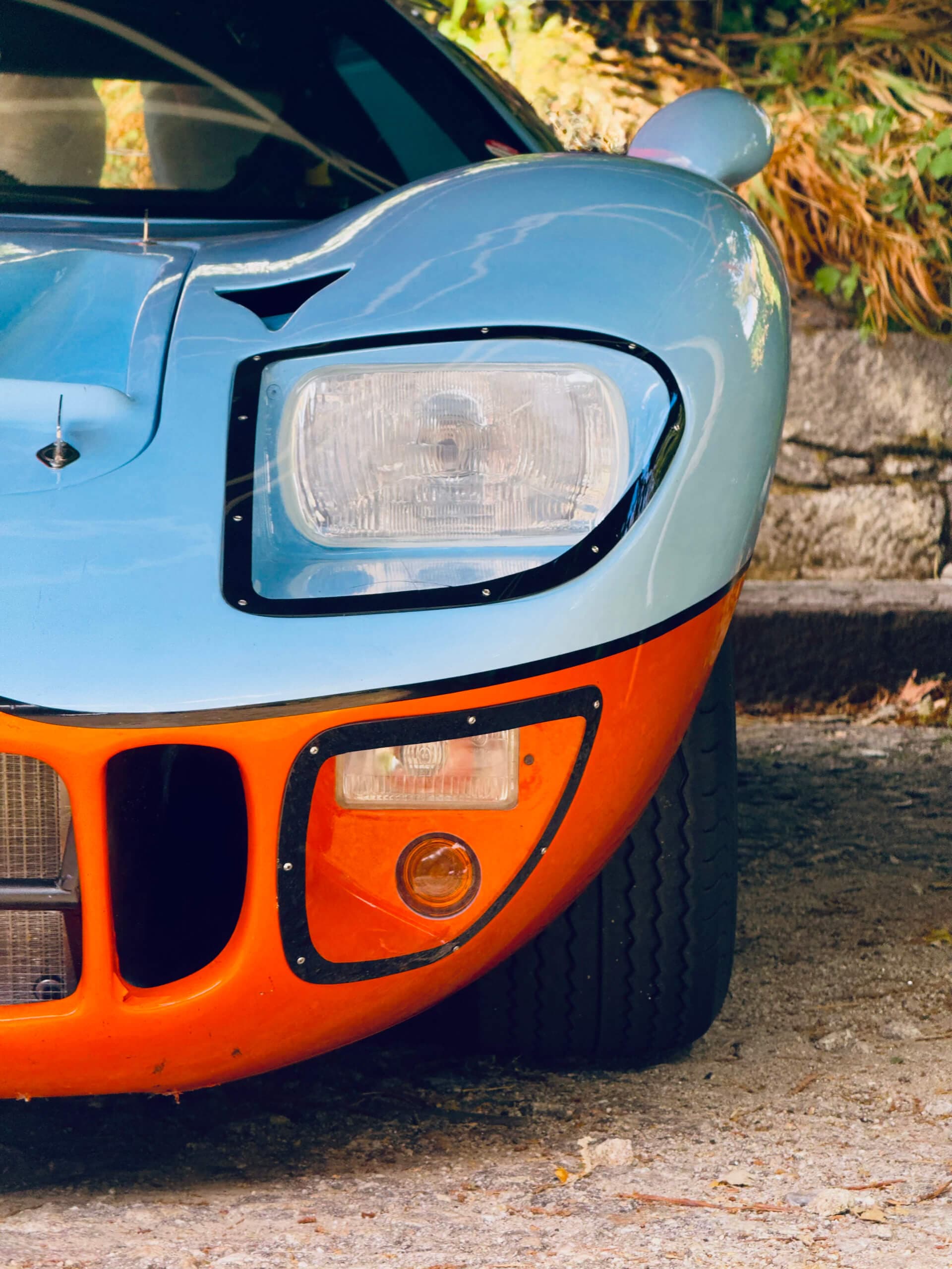 Gulf-livery racing car front detail in blue and orange